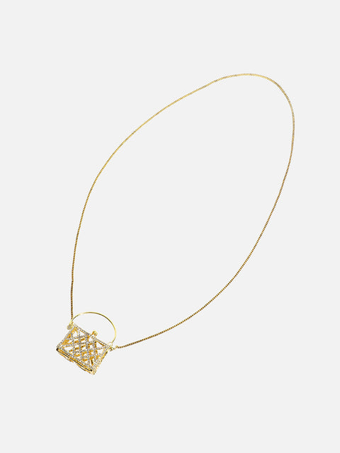 The Golden Duo: Unleashing Glamour with a Metallic Bodychain and Mini Purse